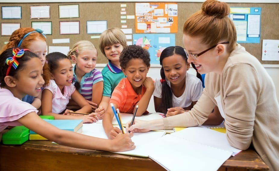 teacher with young students